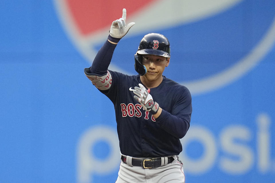 Boston Red Sox's Masataka Yoshida gestures from second base after hitting a double against the Cleveland Guardians duirng the sixth inning of a baseball game Tuesday, June 6, 2023, in Cleveland. (AP Photo/Sue Ogrocki)