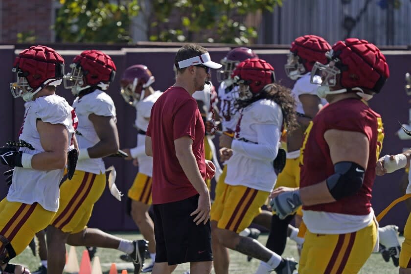 Southern California head coach Lincoln Riley, center, watches his team go through running drills during an NCAA college football practice Tuesday, April 5, 2022, in Los Angeles. (AP Photo/Marcio Jose Sanchez)