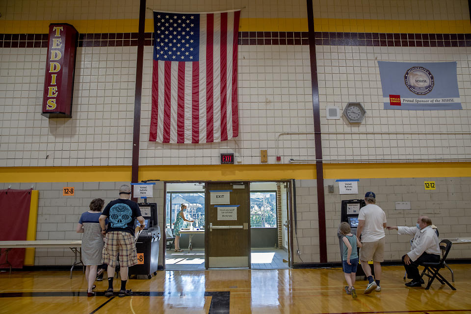 Voters casted their votes at the Roosevelt High School polling location, Tuesday, August 11, 2020 in Minneapolis. (Elizabeth Flores/Star Tribune via AP)