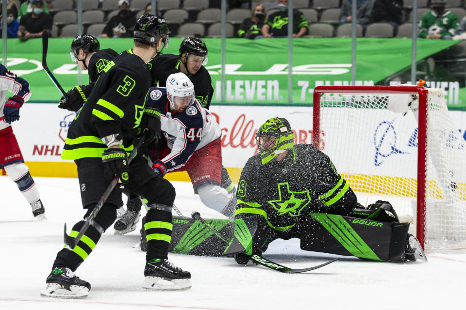 Columbus Blue Jackets defenseman Vladislav Gavrikov (44) scores a goal on Dallas Stars goaltender Jake Oettinger (29) during the first period of an NHL hockey game Saturday, April 17, 2021, in Dallas. (AP Photo/Sam Hodde)