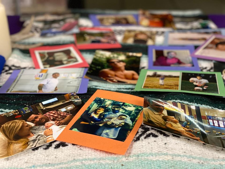 Darcie Johnston and her mother Kelly Eason placed photos of Jason Johnston on his ofrenda for a Dia de los Muertos celebration.