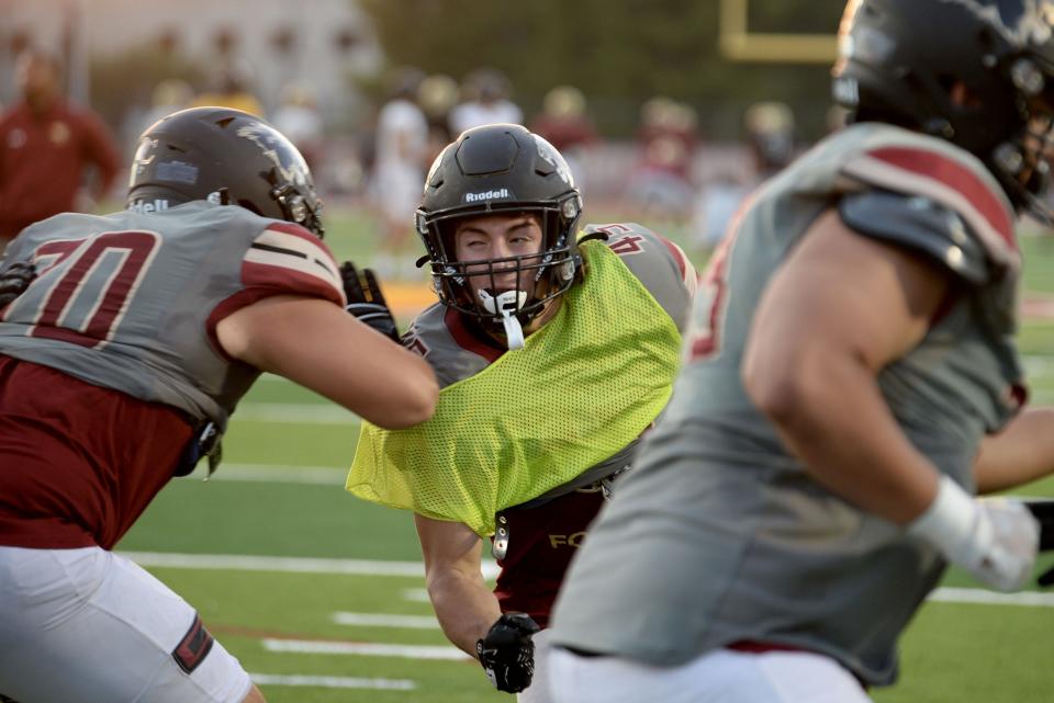 Linebacker Christian Knoos tries to get through the offensive line during an Oaks Christian football team practice on Tuesday, Oct. 11, 2022. The Lions, who are 5-2 overall and 1-0 in the Marmonte League, host rival Westlake on Friday night.