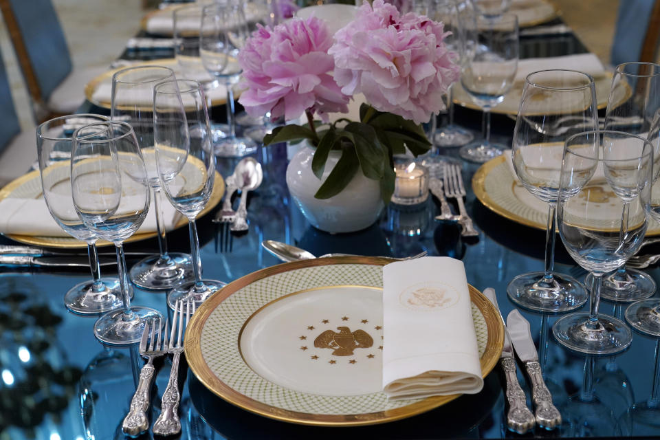 A place setting with George W. Bush State China is displayed during a media preview, Monday, April 24, 2023, in advance of Wednesday's State Dinner with South Korea's President Yoon Suk Yeol at the White House in Washington. (AP Photo/Susan Walsh)