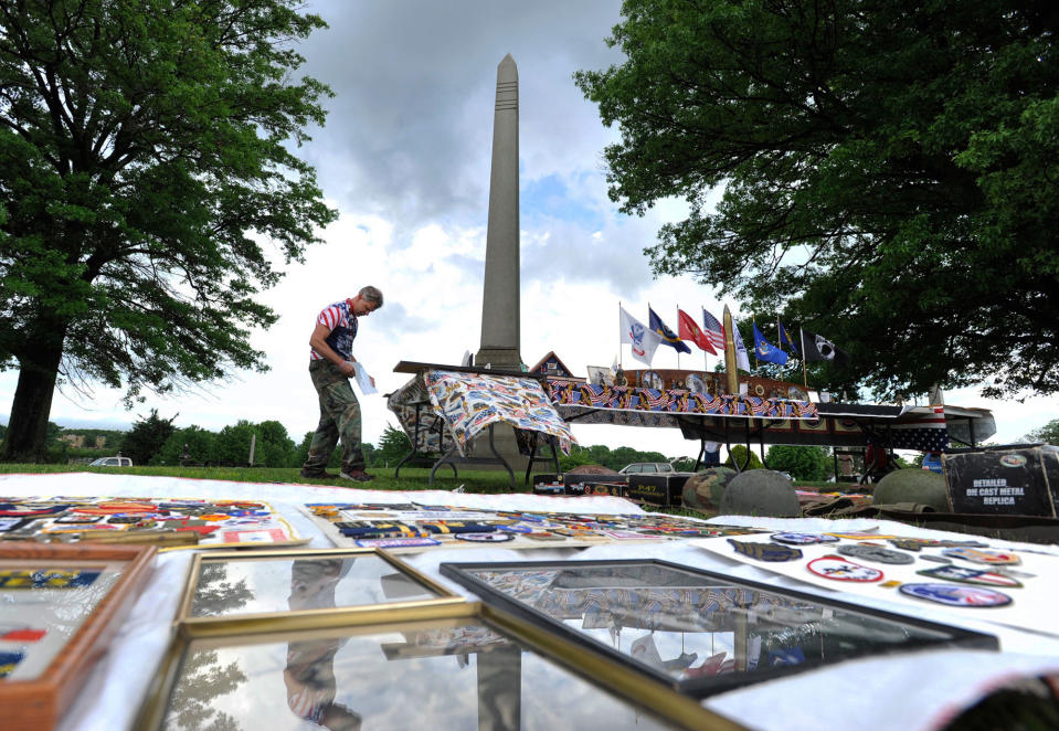 <p>Marty Malek, of Johnstown, puts out his personal collection of World War I and II war artifacts for display at the Westmont Boro Memorial Day ceremony at Johnstown Grandview Cemetery, Monday, May 29, 2017. (Photo: Todd Berkey/The Tribune-Democrat via AP) </p>