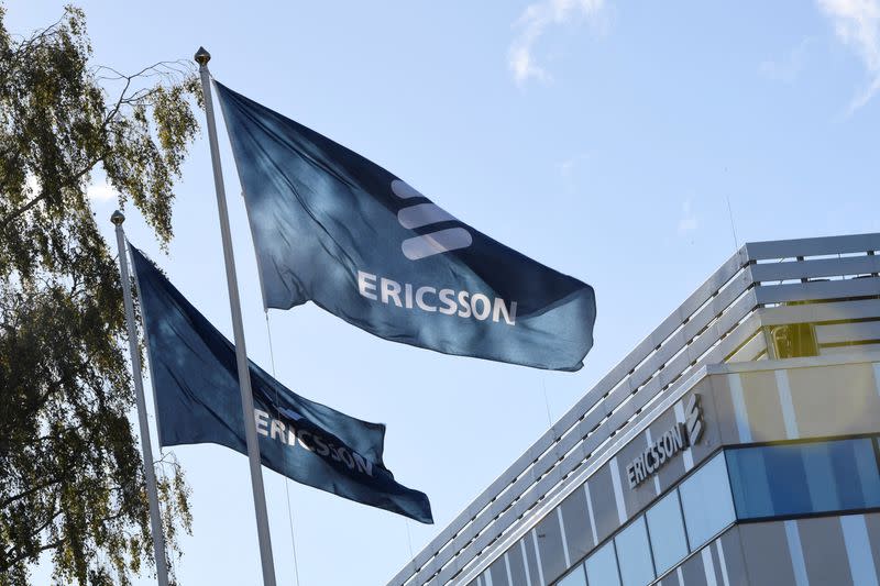 FILE PHOTO: Flags with Ericsson logo are pictured outside company's head office in Stockholm