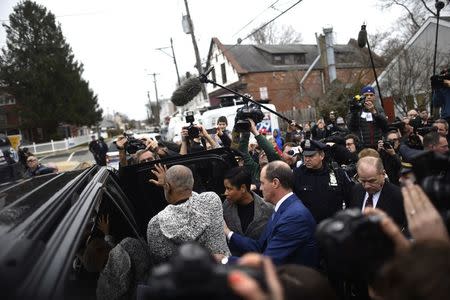 Bill Cosby exits the Montgomery County Courthouse after being arraigned on sexual assault charges in Elkins Park, Pennsylvania December 30, 2015. REUTERS/Mark Makela