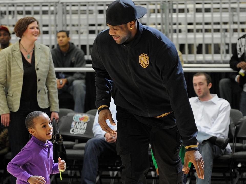 LeBron James Jr. and NBA player LeBron James shoot the ball during the NBA All-Star celebrity game presented by Final Fantasy XIII held at the Dallas Convention Center on February 12, 2010