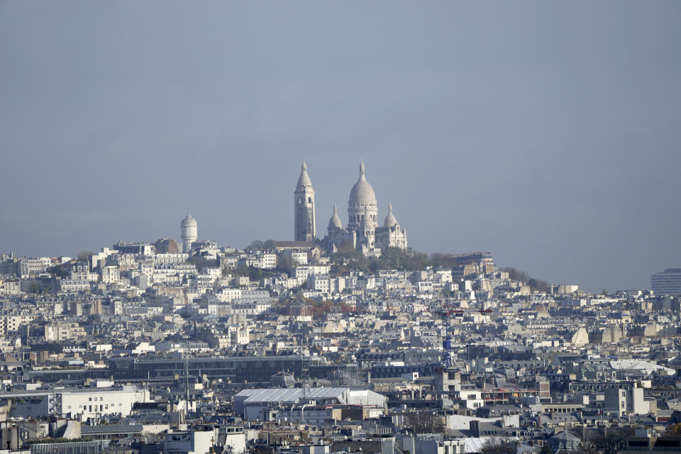 The Sacre Coeur basilica is seen in the Montmartre district, Monday, Nov. 28, 2022 in Paris. Paris is on track to host millions of visitors and successfully stage 32 sporting events next year when the 2024 Olympics open on July 26. That's a welcome return to business as usual for the first post-pandemic Olympics. (AP Photo/Francois Mori)