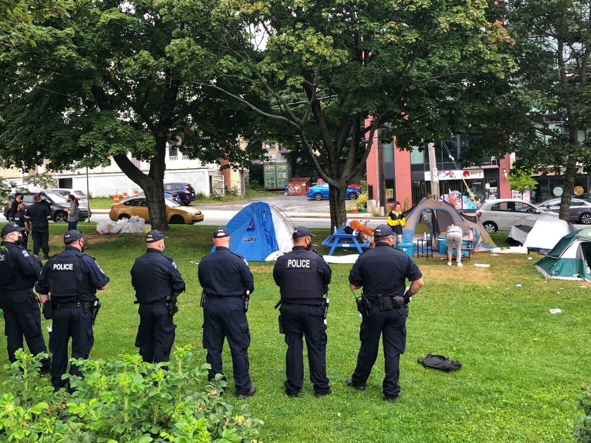 Halifax police and city staff clear the tent encampments in the Peace and Friendship Park on Aug.18. Some people reported being handed $237 tickets for breaking a bylaw about living on municipal land. (Brett Ruskin/CBC - image credit)
