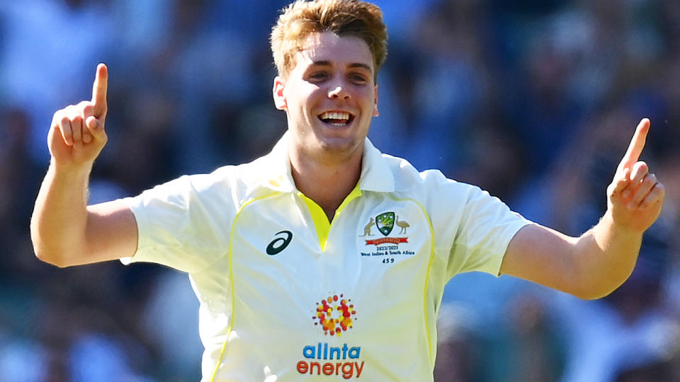 Cameron Green raises his arms in celebration after taking a wicket against South Africa at the Boxing Day Test.