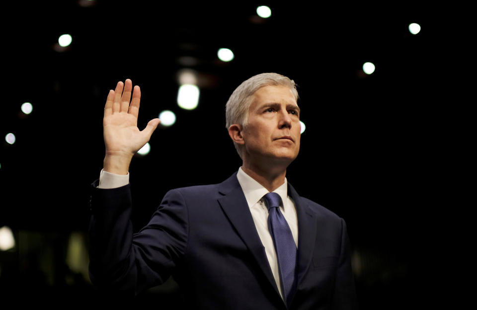 FILE PHOTO - U.S. Supreme Court nominee judge Neil Gorsuch is sworn in to testify at his Senate Judiciary Committee confirmation hearing on Capitol Hill in Washington, U.S. on March 20, 2017. REUTERS/James Lawler Duggan/File Photo