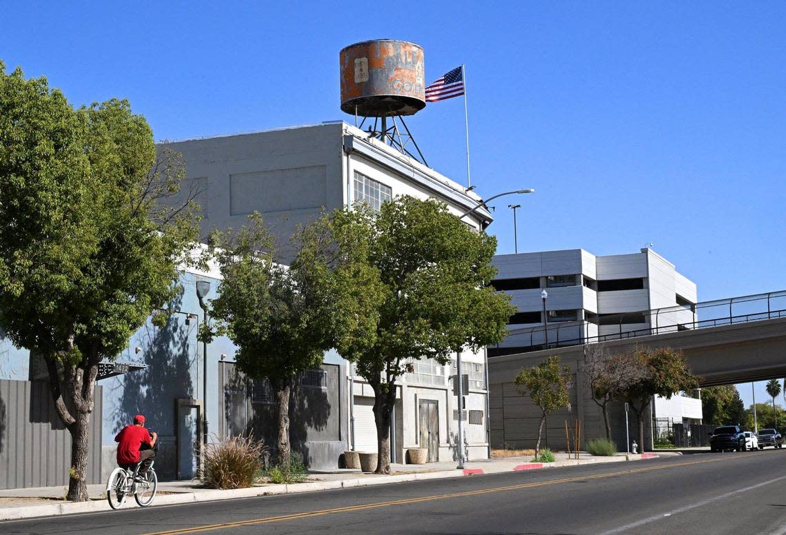The historical Dale Bros. Coffee landmark, seen perched on top of a building on H Street, with the Tuolumne Street overpass seen in the background, is slated to be removed. Photographed Tuesday, Oct. 3, 2023 in Fresno.