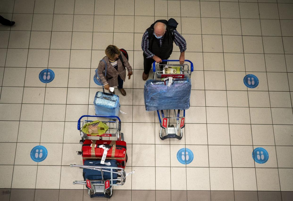 <span class="caption">People wait at O. R. Tambo International Airport in Johannesburg, South Africa on Nov. 26, 2021, as many nations moved to stop air travel from the country. </span> <span class="attribution"><a class="link " href="https://newsroom.ap.org/detail/VirusOutbreakNewVariant/1d9f4669cabe407ebc7b3c5c3ab4804b/photo?Query=south%20africa&mediaType=photo&sortBy=&dateRange=now-14d&totalCount=140&currentItemNo=83" rel="nofollow noopener" target="_blank" data-ylk="slk:AP Photo/Jerome Delay;elm:context_link;itc:0;sec:content-canvas">AP Photo/Jerome Delay</a></span>