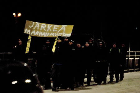 A group that call themselves the "Soldiers of Odin" demonstrate in Joensuu, Eastern Finland, January 8, 2016. REUTERS/Minna Raitavuo/Lehtikuva