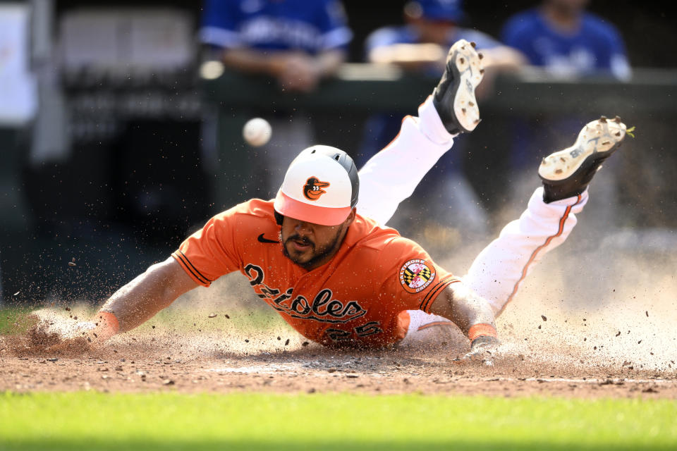 Baltimore Orioles' Anthony Santander slides home to score on a single by Austin Hays during the fifth inning of a baseball game against the Kansas City Royals, Saturday, June 10, 2023, in Baltimore. (AP Photo/Nick Wass)