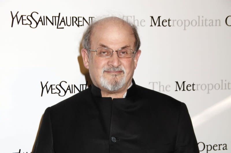 Salman Rushdie arrives for the Metropolitan Opera's Premiere of Jules Massemet's "Manon" at the Metropolitan Opera House at Lincoln Center in New York on March 26, 2012. On September 24, 1998, Iran's foreign minister announced the country had dropped its 1989 call for the death of = Rushdie, author of "The Satanic Verses," which many Muslims found blasphemous. File Photo by Laura Cavanaugh/UPI