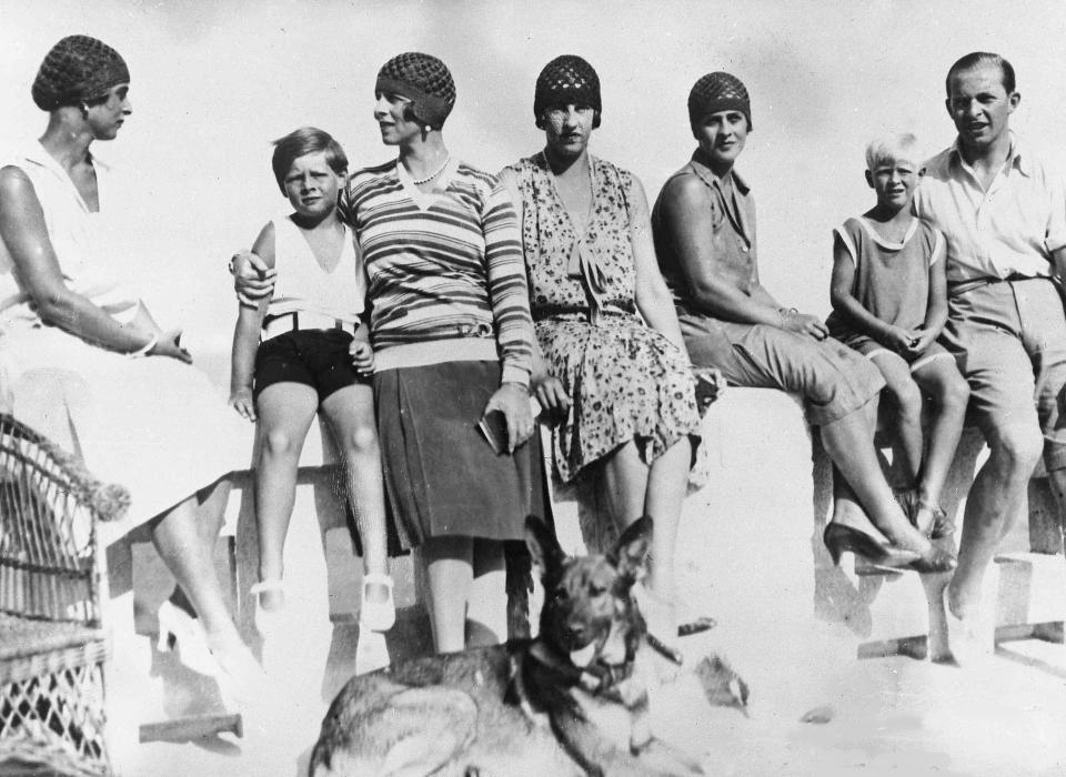 FILE - In this Sept. 8, 1928 file photo, Romania's King Michael, second left, with his mother, Princess Helene, enjoy a holiday at Mamaia, Romania. From left, Princess Fedora of Greece, King Michael, Princess Helene, Princess Irene of Greece, Princess Marguerite of Greece, Prince Philip of Greece and Prince Paul of Greece. Prince Philip was born into the Greek royal family but spent almost all of his life as a pillar of the British one. His path was forged when he married the heir to the British throne, and a promising naval career was cut short when his wife suddenly became Queen Elizabeth II. Nevertheless, he set about forging a place for himself as royal consort. He was a patron of charities and a supporter of projects for young people. He was married for more than 73 years and was still carrying out royal engagements into his late 90s. (AP Photo/File)