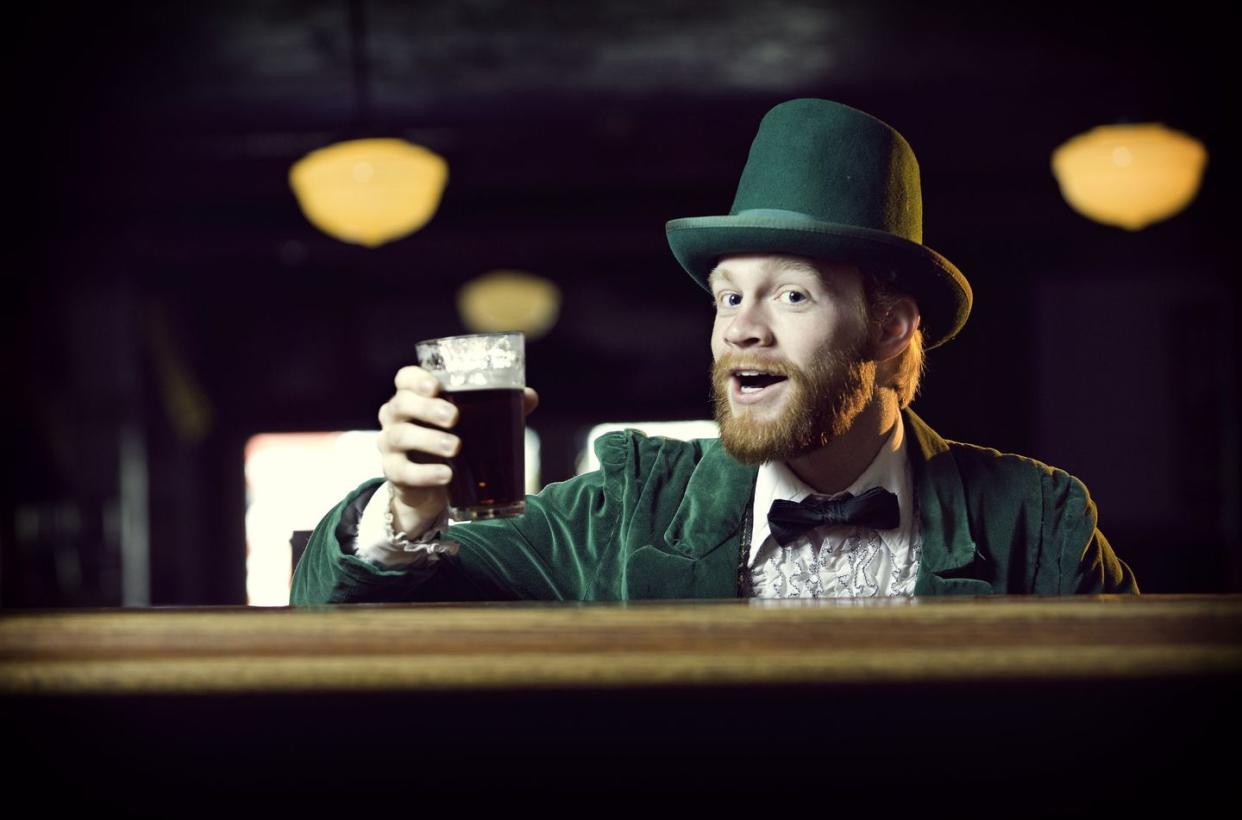 man dressed as leprechaun in pub