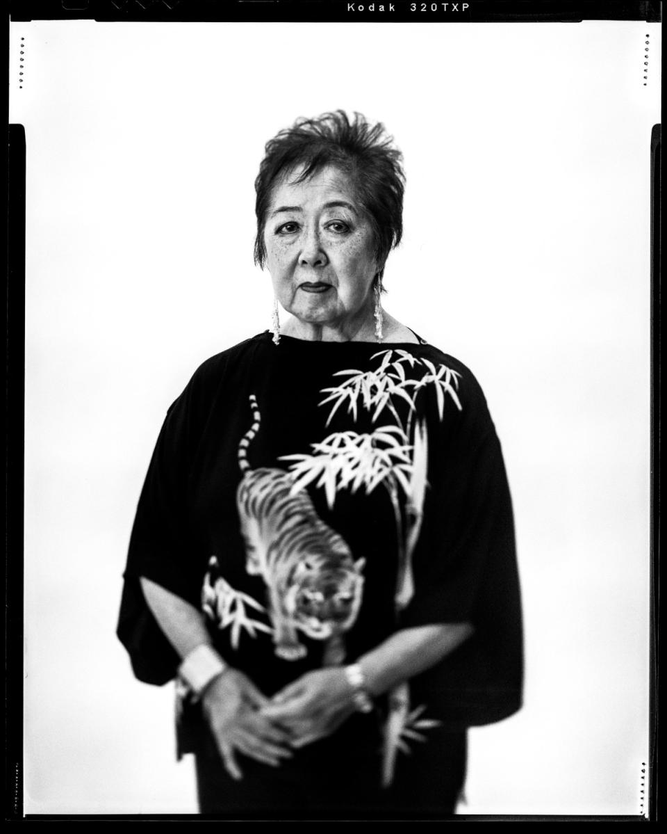 Black and white film photo of a woman, Miya Iwataki, in a dress made from a recycled vintage kimono