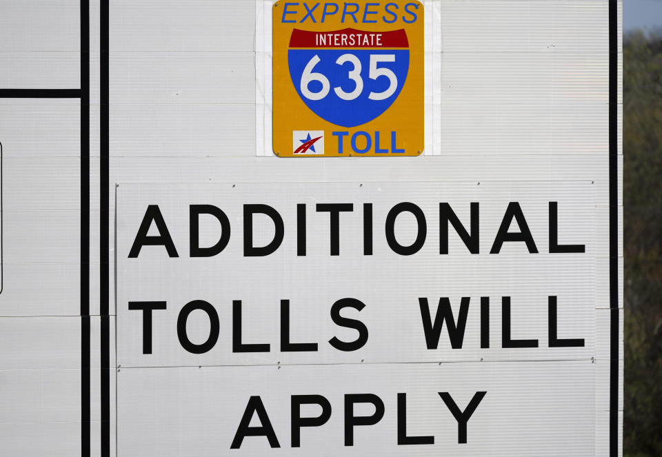 An express lanes highway sign marks an entrance in Dallas, Friday, March 3, 2023. There is growing interest in the South in fee-based express lanes in which some drivers can up to avoid congestion on highways where other drivers can access general lanes for free. (AP Photo/LM Otero)