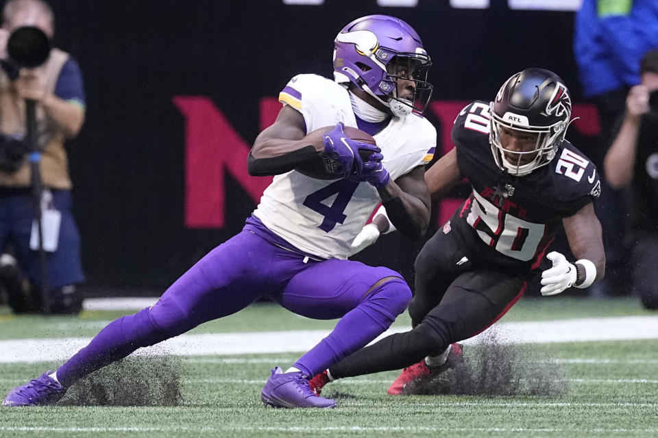 Minnesota Vikings wide receiver Brandon Powell (4) runs after a catch past Atlanta Falcons cornerback Dee Alford (20) during the first half of an NFL football game, Sunday, Nov. 5, 2023, in Atlanta. (AP Photo/John Bazemore)