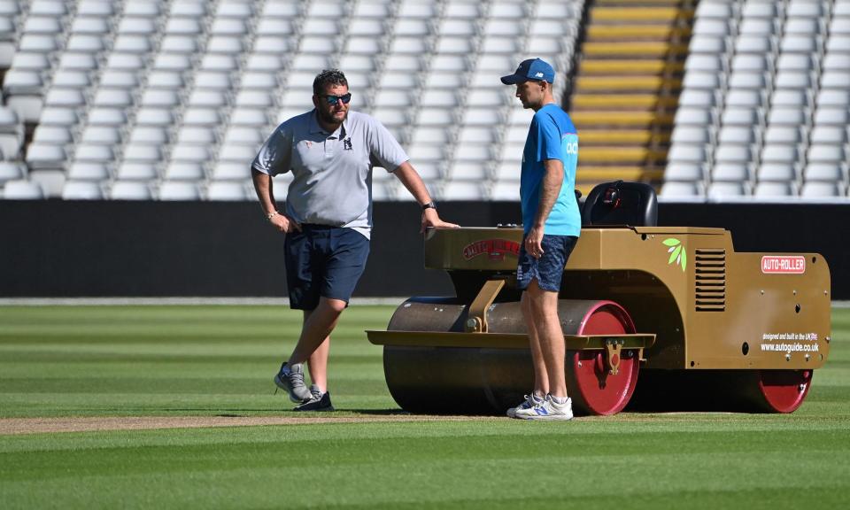 <span>Joe Root speaks to Gary Barwell before England’s Test against New Zealand at Edgbaston in 2021. </span><span>Photograph: Paul Ellis/AFP/Getty Images</span>