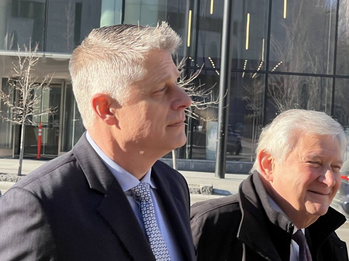 Retired vice-admiral Haydn Edmundson, left, seen with his lawyer Brian Greenspan, faced cross-examination in an Ottawa courtroom Tuesday. Edmundson has been charged with one count of sexual assault and one count of committing indecent acts. He has pleaded not guilty and denied any wrongdoing.  (Mark Gollom/CBC - image credit)