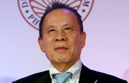 FILE PHOTO -- Kazuo Okada, chairman of Tiger Resort, Leisure and Entertainment Inc. listens at the press launch of 65th annual Miss Universe competition on January 30, 2017 to be held in the Philippines, during a news conference in Makati city, Metro Manila, Philippines November 16, 2016. REUTERS/Erik De Castro/File Photo