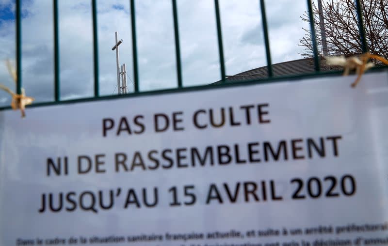 A sign is pictured on the gate of the Eglise de la Porte Ouverte Chretienne in Mulhouse