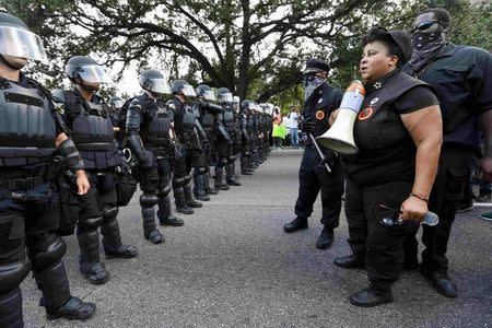 Demonstrators protest the shooting death of Alton Sterling near the headquarters of the Baton Rouge Police Department in Baton Rouge, Louisiana, U.S. July 9, 2016. REUTERS/Jonathan Bachman/File Photo