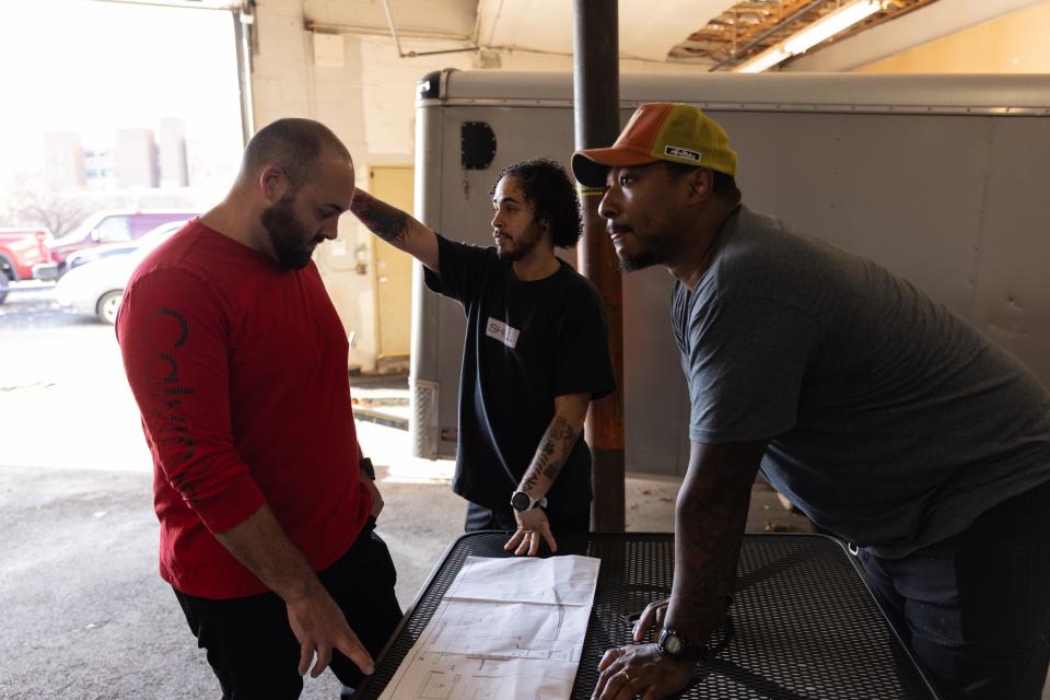 Cruz Nieves (center) on site at the future Shell restaurant. Raynard Puente (left) is his brother and business partner and Marko Kelly (right) will sous chef.