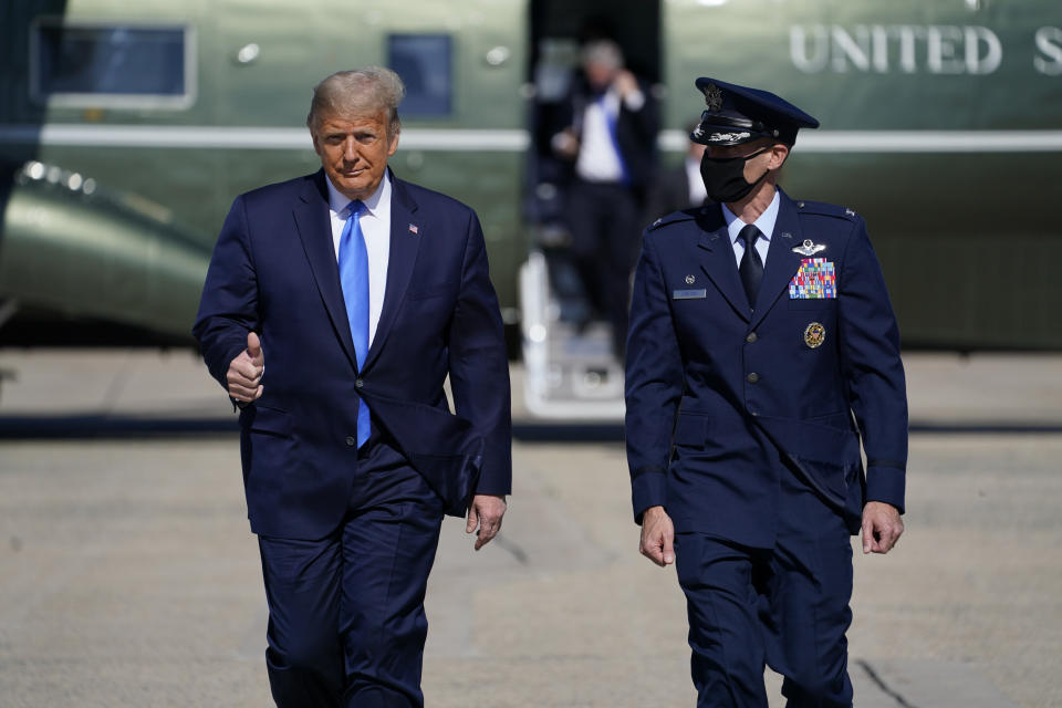 President Donald Trump gives a thumbs-up as he walks to board Air Force One at Andrews Air Force Base in Maryland for a trip to Greenville, North Carolina, to attend a campaign rally on Oct. 15. (Photo: ASSOCIATED PRESS)