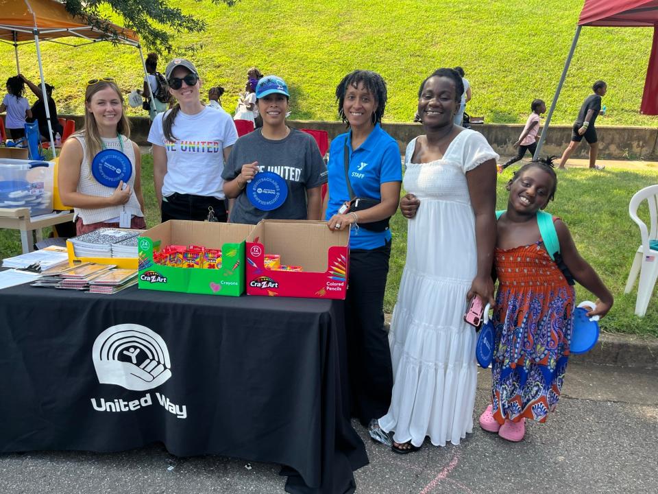At the United Way of Greater Knoxville booth are Amanda Parker of the YMCA; Pam Headrick and Cristina Want of the United Way; LaToya Shephard of the YWCA, Trisce Michael and her daughter Jealene. Aug. 1, 2023