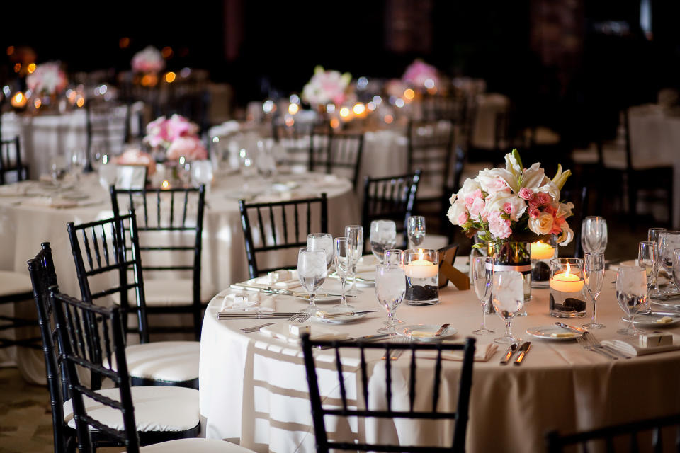 An empty wedding reception set up before dinner