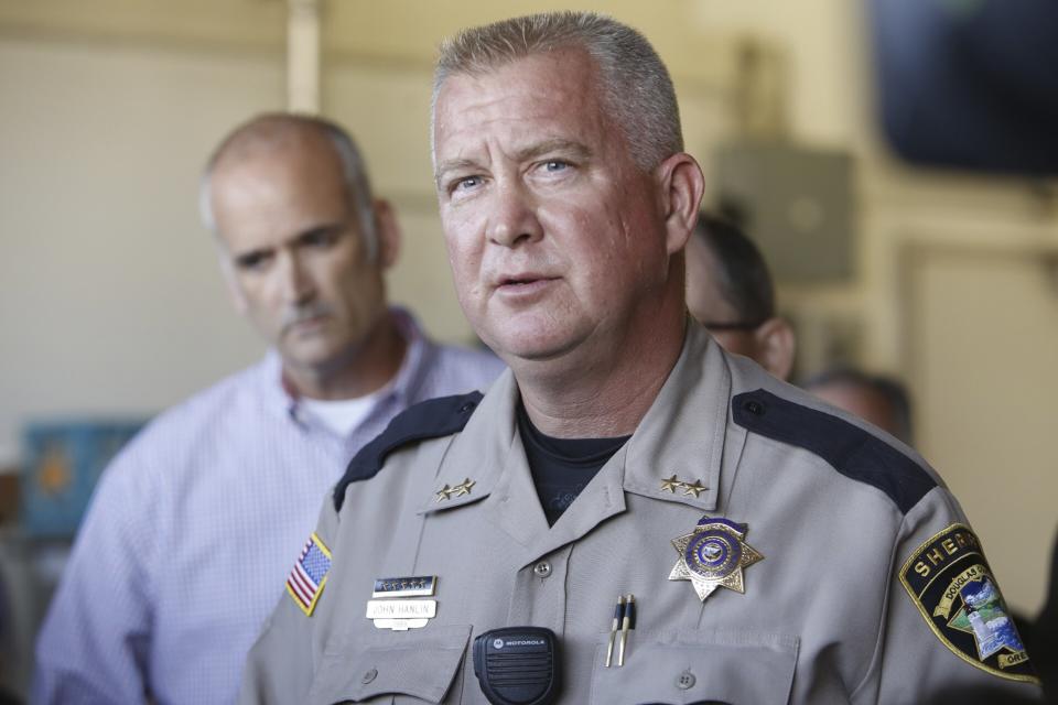 Douglas county sheriff John Hanlin pauses while speaking to media after a mass shooting at Umpqua Community College in Roseburg,Oregon October 1, 2015. A gunman opened fire at a community college in southern Oregon on Thursday, killing 13 people and wounding some 20 others before he was shot to death by police, state and county officials said, in the latest mass killing to rock a U.S. school. There were conflicting reports on the number of dead and wounded in the shooting rampage in Roseburg, which began shortly after 10:30 a.m. local time (1730 GMT). REUTERS/Steve Dipaola