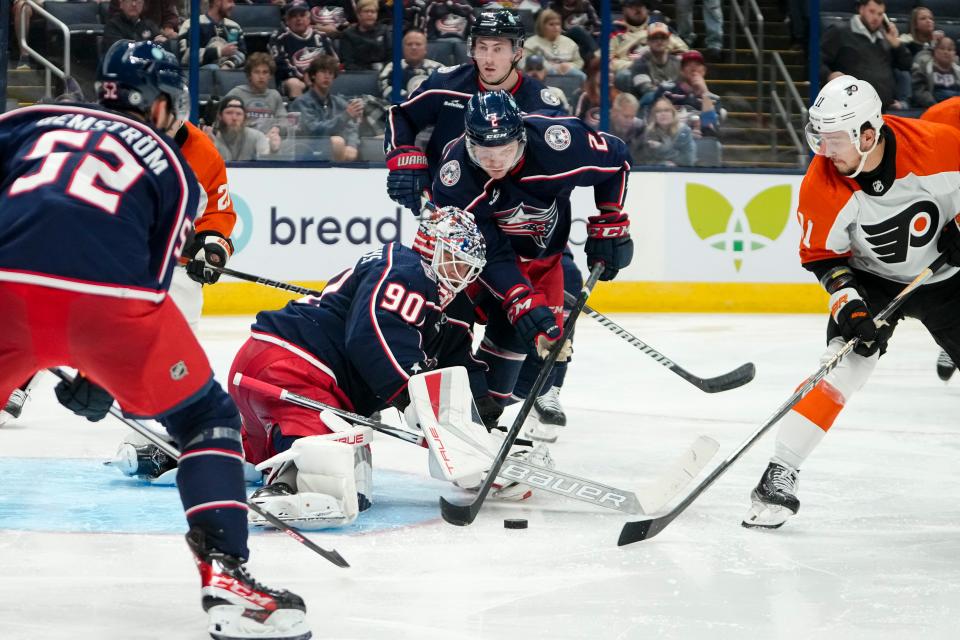Oct 12, 2023; Columbus, Ohio, USA; Columbus Blue Jackets goaltender Elvis Merzlikins (90) stops a shot from Philadelphia Flyers right wing Travis Konecny (11) during the second period of the NHL hockey game at Nationwide Arena.