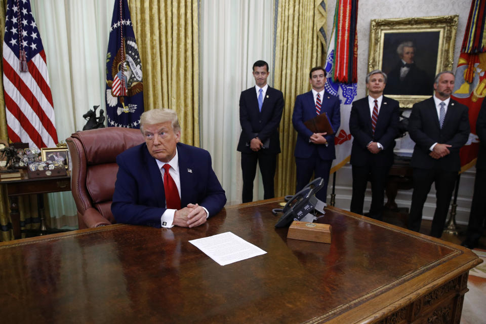 President Donald Trump participates in a law enforcement briefing on the MS-13 gang in the Oval Office of the White House, Wednesday, July 15, 2020, in Washington. (AP Photo/Patrick Semansky)