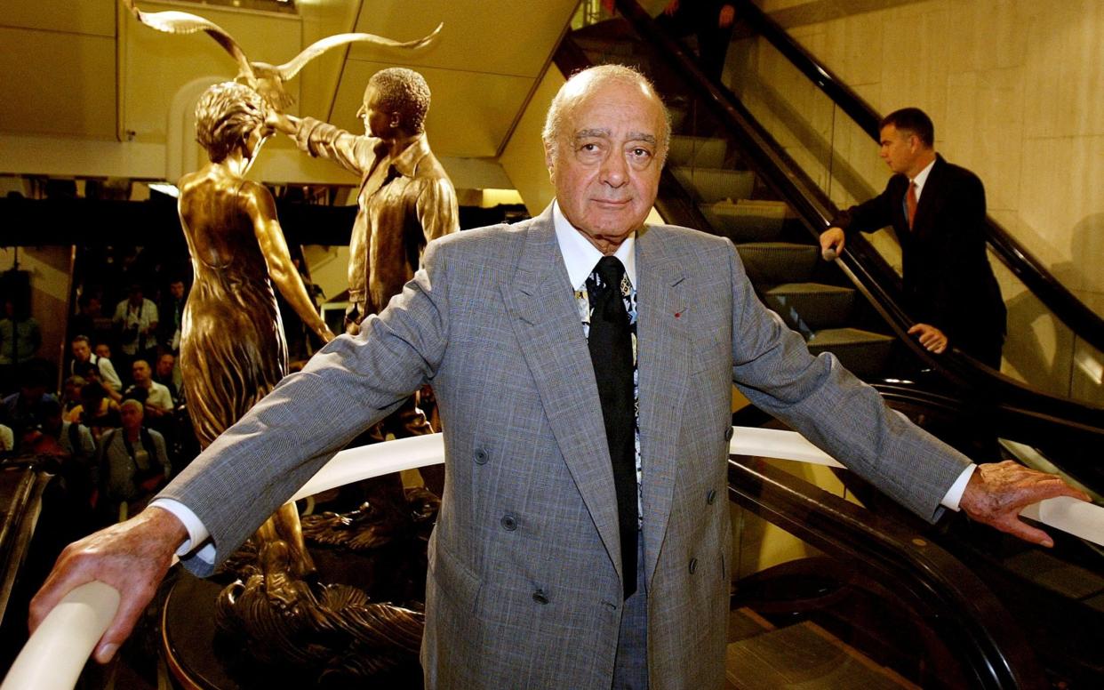 Mohamed al-Fayed unveiling a memorial to his son Dodi and Britain's Diana Princess of Wales at Harrods in 2005