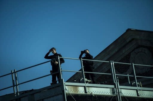 Members of the Secret Service counter sniper team keep watch outside the Henry Ford Museum in Dearborn, Michigan. The US Secret Service said Wednesday that three employees will leave their jobs over the sex scandal in a hotel in Colombia which tarnished the elite presidential protection agency's image