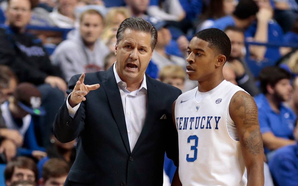 Kentucky head coach John Calipari talks to UK point guard Tyler Ulis during an exhibition game at the beginning of the 2014-15 season.