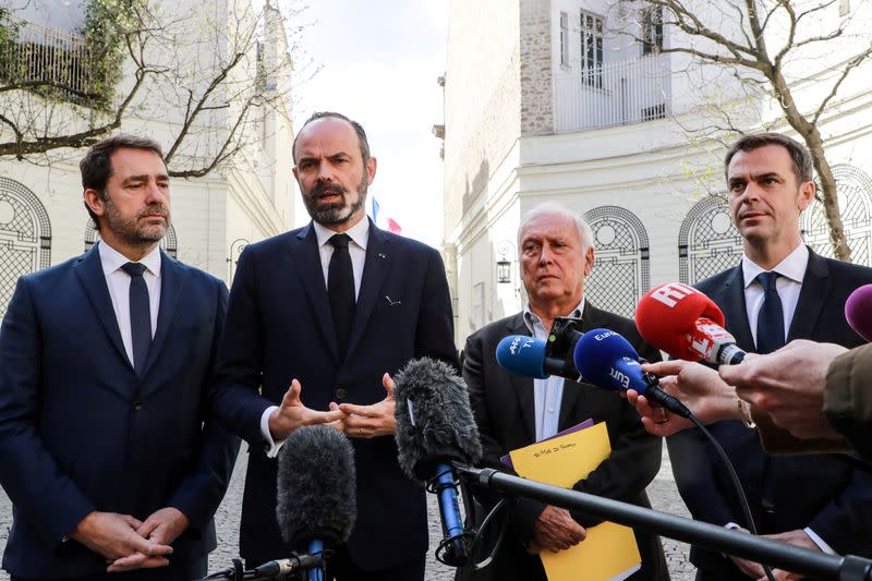 French Health and Solidarity Minister Veran, French Prime Minister Philippe, French Interior Minister Castaner and immunologist Delfraissy address the media in the courtyard of the French Interior Ministry in Paris