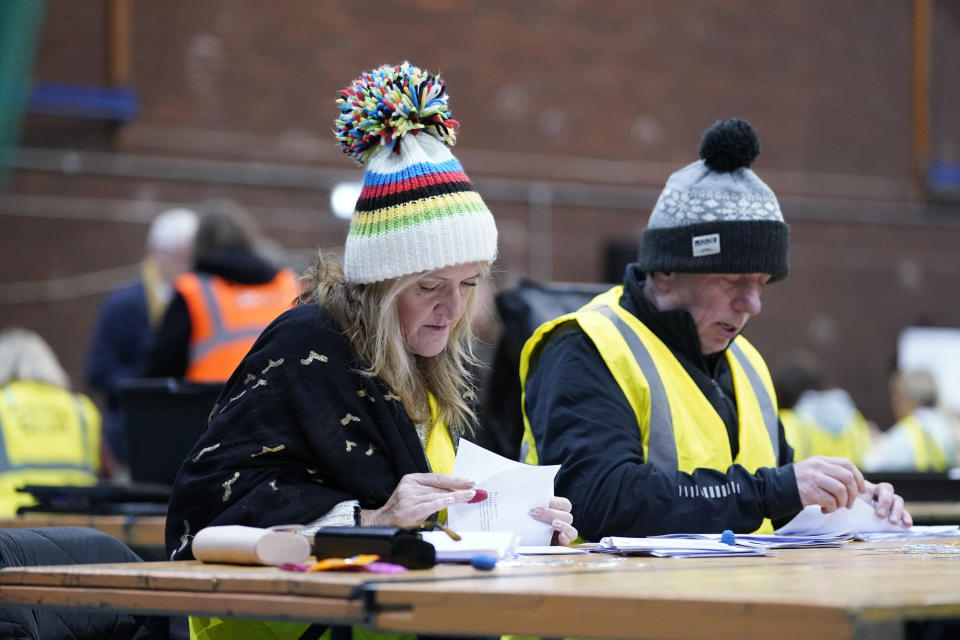 Votes are counted during the count at Northgate Arena Leisure Centre for the City of Chester by-election, in Chester, England, Thursday, Dec. 1, 2022. The by-election is to replace former Labour MP Christian Matheson who resigned after complaints of "serious sexual misconduct" were upheld by a parliamentary watchdog. (Danny Lawson/PA via AP)