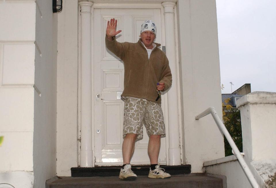 Johnson, in his trademark early morning jogging gear, outside his London home in 2004. (PA)