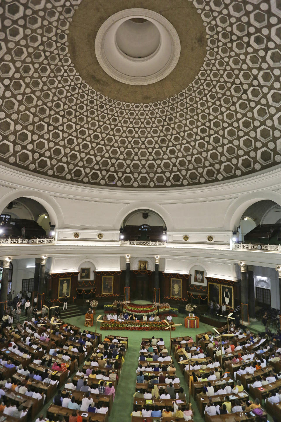 Newly elected lawmakers from India's ruling alliance led by the Hindu nationalist Bharatiya Janata Party (BJP) participate in meeting to elect Narendra Modi as their leader in New Delhi, India, Saturday, May 25, 2019. BJP president Amit Shah announced Modi's name as the leader of the National Democratic Alliance in a meeting of the lawmakers in the Central Hall of Parliament in New Delhi, paving the way for Modi's second five-year term as prime minister after a thunderous victory in national elections. (AP Photo/Manish Swarup)