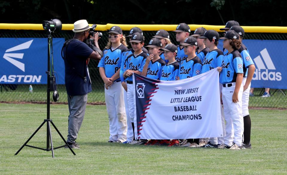 The Toms River East players, the New Jersey state champions, pose for a team photo before the start of the Metro Region Tournament in Bristol, Conn., on Saturday. They defeated Cumberland, 3-2, on Sunday night and eliminated the Rhode Island champs.