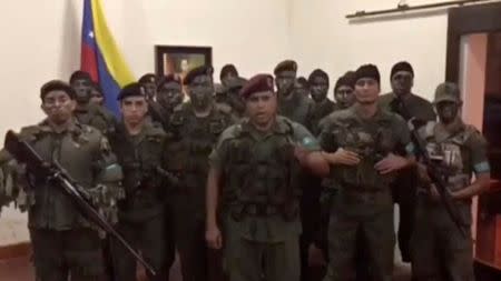 A still image from video released by Operation David Carabobo purportedly shows a group of men dressed in military uniforms announcing uprising in Valencia, Venezuela August 6, 2017. Operation David Carabobo/Handout via REUTERS