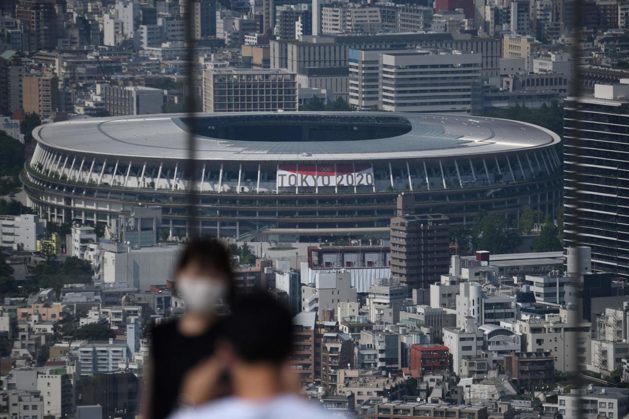 A general view shows the National Stadium (C), the main venue for the 2020 Olympic and Paralympic Games in Tokyo on June 21, 2021. (Photo by Kazuhiro NOGI / AFP) (Photo by KAZUHIRO NOGI/AFP via Getty Images)