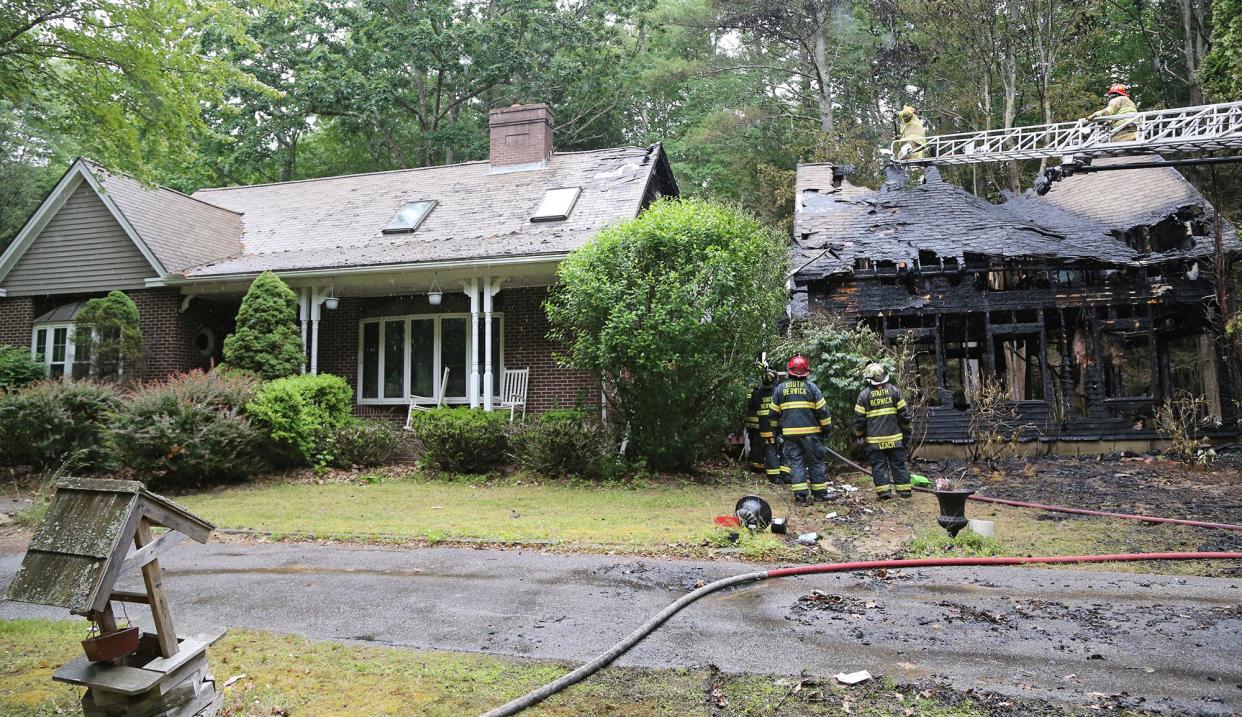 A fire at 38 Watson Road in Dover destroyed a garage but firefighters saved the home Tuesday, June 28, 2022.