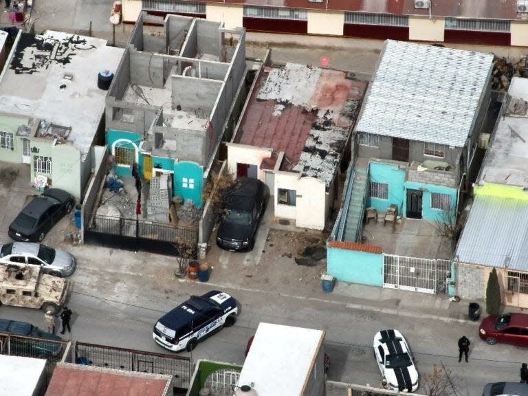 A Chihuahua state police aerial drone provides an overhead view as police and Mexican military troops search a home during a series of 16 raids on Friday in Juárez.