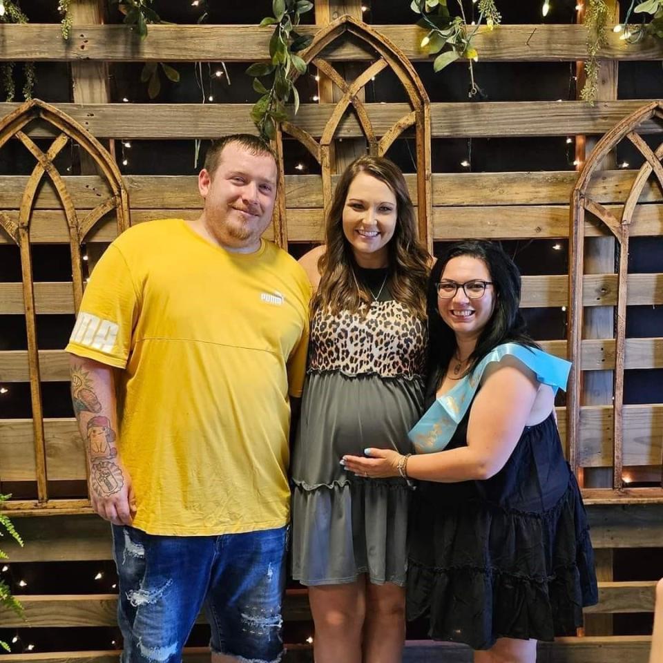 Shane and Brittany Ingle with their friend and surrogate, Keri Fox.